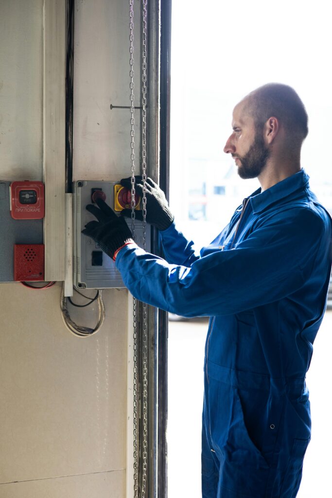 Electrician servicing electrical panel