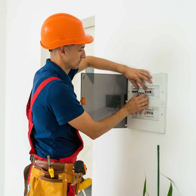 Electrician working on Panel Adobe522468963 Electrician working on Panel Adobe522468963